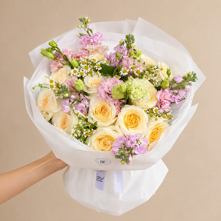 Soft, romantic, and effortlessly elegant, our Rosy Candlelight Bouquet features creamy Candlelight roses, classic roses, delicate pink lisianthus, and fragrant stock flowers. The blend of blush, pink, and warm ivory tones creates a lush, feminine arrangement with a timeless romantic feel.

Perfect for birthdays, anniversaries, date nights, romantic surprises, Girlfriend’s Day, or simply sending someone beautiful flowers. Each bouquet is handcrafted by RF Flowers using fresh, premium blooms