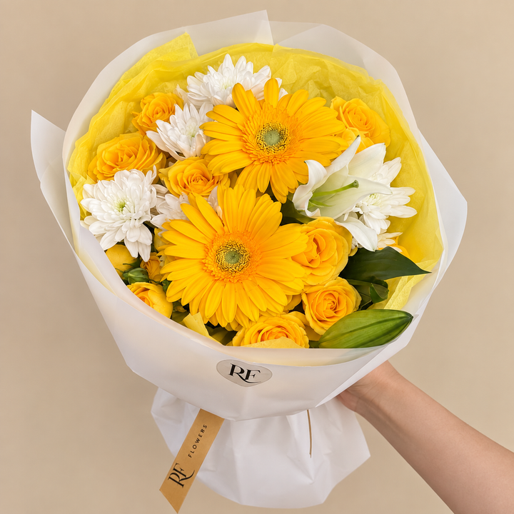 Bright, cheerful, and full of sunshine, our Yellow Ember Bouquet features vibrant yellow gerberas, delicate yellow spray roses, and a graceful lily arranged into a charming petite bouquet.

Created especially for Yellow Flowers Day, this small bouquet is perfect for September 21, birthdays, thoughtful surprises, or simply sending someone a little happiness. Handcrafted by RF Flowers with fresh, premium blooms.

Preorder the Yellow Ember Bouquet for Yellow Flowers Day and flower delivery in Chicago